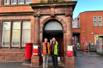 Stuart on a previous visit to a local post office