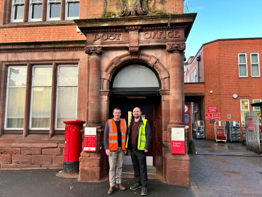 Stuart on a previous visit to a local post office